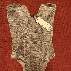 Deep V strapless body suit